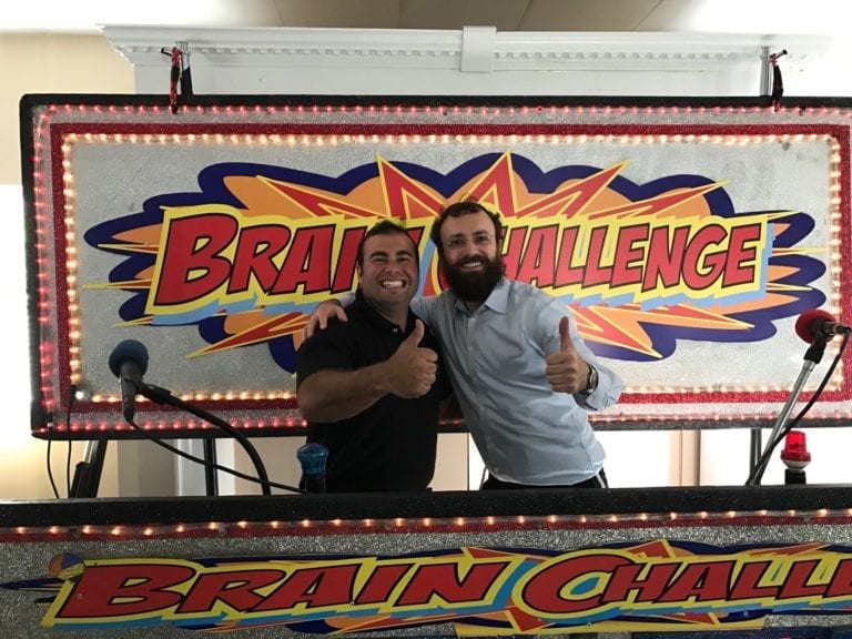 thumbs up from male contestant at brain challenge game show in tri-state area